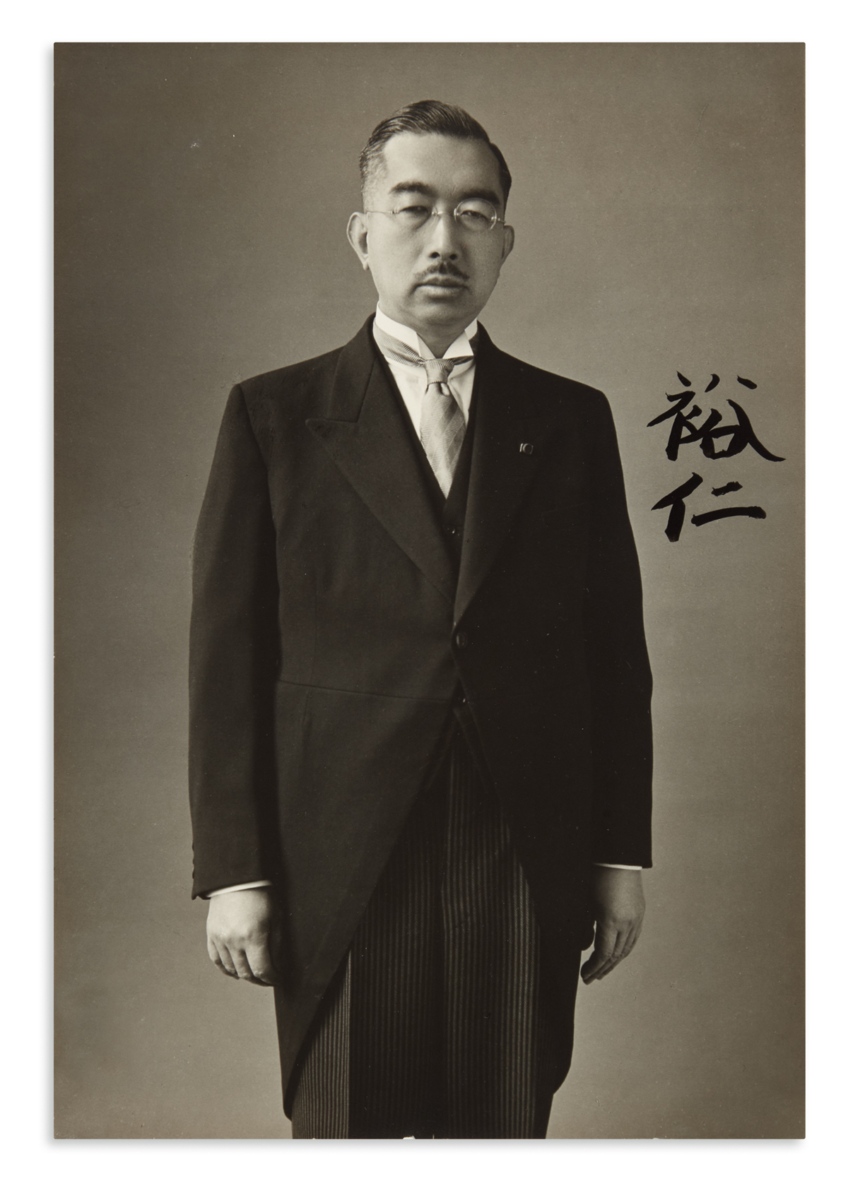 HIROHITO AND NAGAKO; EMPEROR AND EMPRESS OF JAPAN. Two Photographs Signed, each by one, in Japanese,